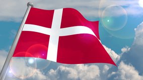 The flag of the state of Denmark develops in the wind against a blue sky with cumulus clouds and a flash on the lens from the sun. 4K video loops and decodes from a 3D program.