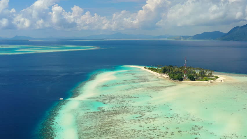 Aerial view of Pulau Sibuan, little islet near city Semporna - Celebes Sea, landscape panorama of Borneo island, Sabah, Malaysia
