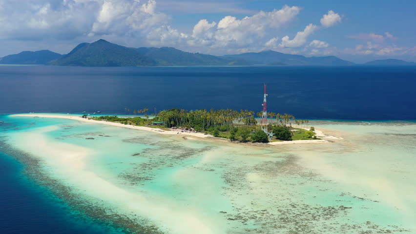 Aerial view of Pulau Sibuan, little islet near city Semporna - Celebes Sea, landscape panorama of Borneo island, Sabah, Malaysia