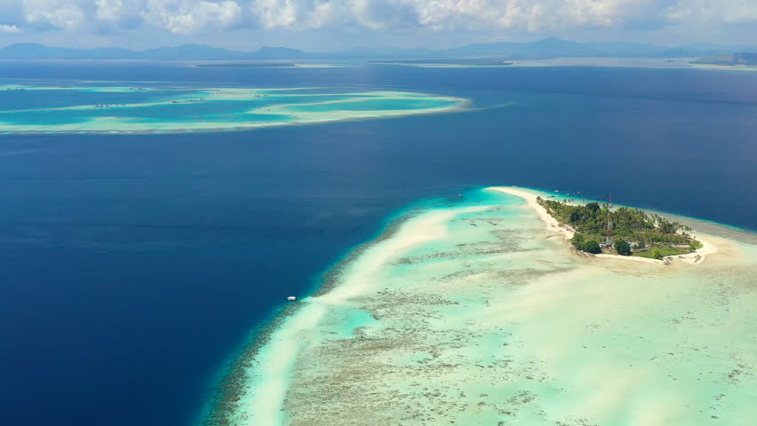 Aerial view of Pulau Sibuan, little islet near city Semporna - Celebes Sea, landscape panorama of Borneo island, Sabah, Malaysia