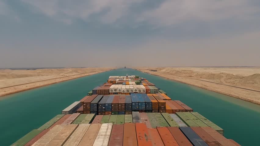 Suez, Egypt - huge container vessel proceeding through the Suez Canal. Time laps | Shutterstock HD Video #1019617432