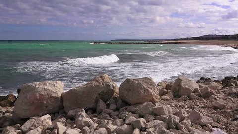 Beautiful sea landscape, closeup stones on the stormy sea background