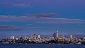 Time lapse from the financial district from San Francisco Bay , sunset transition to night  with
beautiful lights and 
airplanes behind the city moving in the sky.