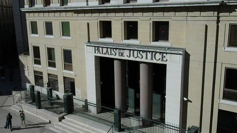 August 2018. 4k footage of the main entrance of the provincial District Court town hall. We are in the late afternoon, so the activities are reduced to a minimum. August 2018 in Nimes