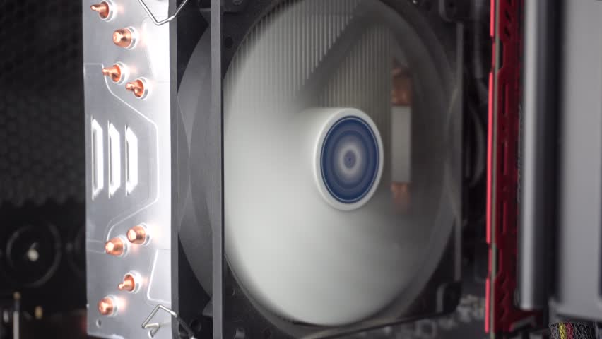 Computer Hardware With Running Fans, Close Up of CPU Heat Sink