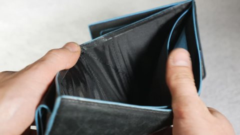 Man showing empty wallet