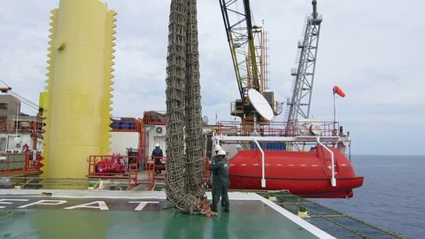 Terengganu, Malaysia: November 10, 2018 - Preparation works to lift up the helideck net using the crane in oil platform in Terengganu, Malaysia.