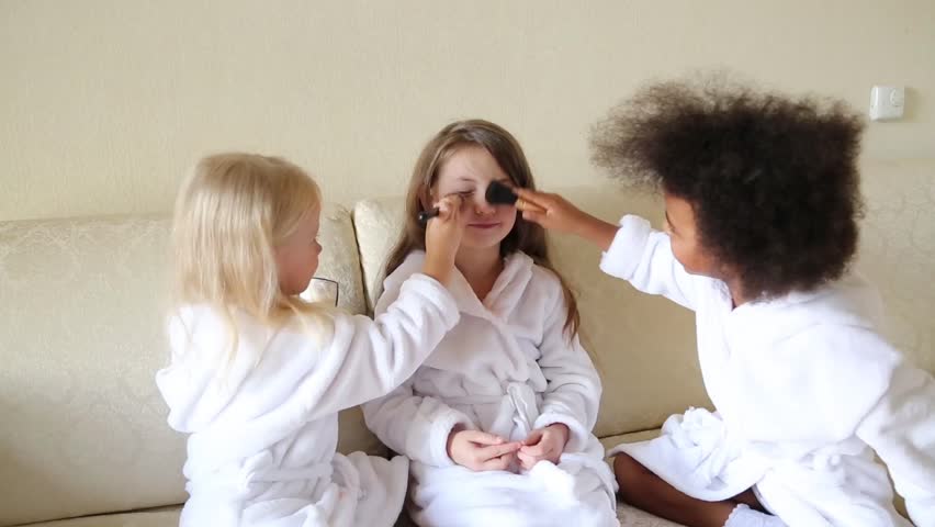 little girls playing with makeup