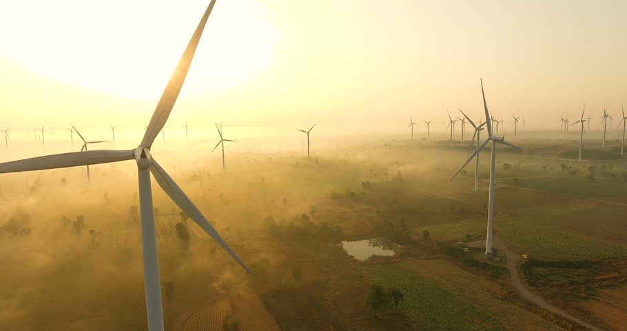 Aerial view of Wind turbines Energy Production- 4k aerial shot on sunset. 4k drone footage turbines at sunrise with clouds | Shutterstock HD Video #1019634475