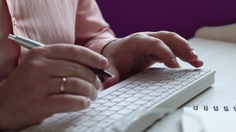 Close up of a man using computer / HD stock footage of person's hands typing on computer keyboard