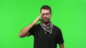 Man with glasses on green screen chroma key background unhappy and frustrated with something