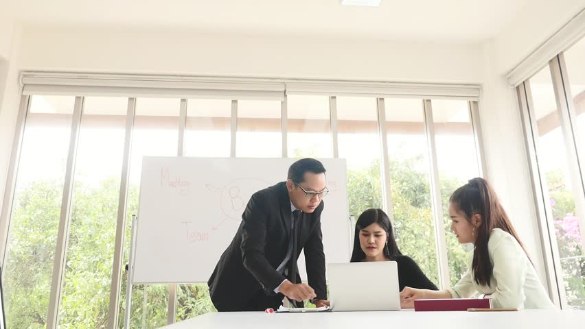 Asian Businesspeople are discussing while meeting together at the office. | Shutterstock HD Video #1019663326