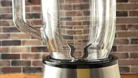 Nuts is pouring in blender, slow motion video