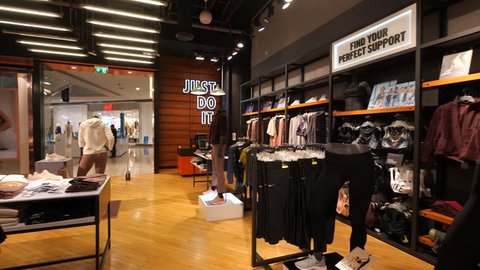 DUBAI - OCTOBER, 2018: Nike store inside Dubai Mall. Nike is one of the world's largest suppliers of athletic shoes and apparel. The company was founded on January 25, 1964. 