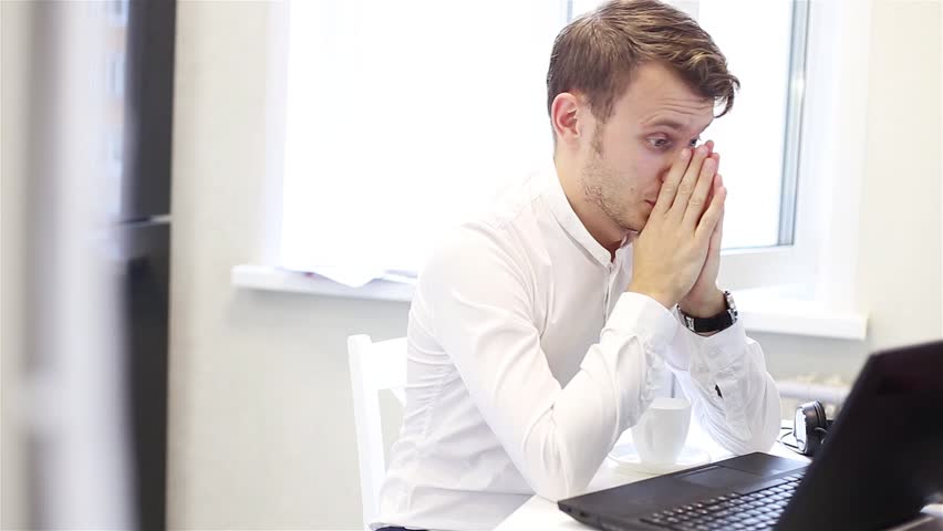 Exciting disappointment of a businessman, loss in the Internet exchange, lottery. Office worker is indignant looking at a laptop. Royalty-Free Stock Footage #1019696206