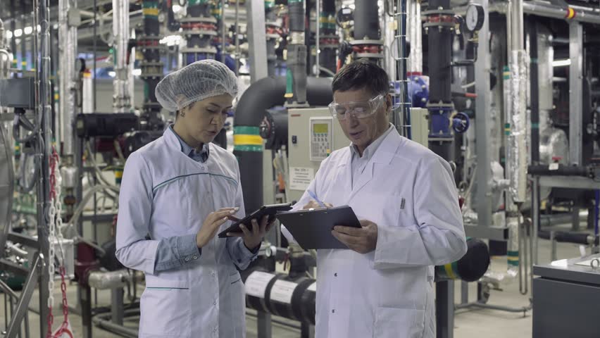 Supplier with engineer checking on production in medical factory. Royalty-Free Stock Footage #1019706322