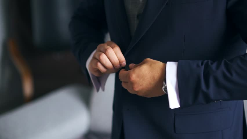 Stylish Caucasian Young Man In A Suit Buttoning Blue Jacket At A Wedding. Close Up Royalty-Free Stock Footage #1019708473