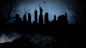 On the cemetery are visible silhouettes statue of Liberty houses and trees. Smoky background - Powered by Shutterstock - Get 15% off with code: PIKWIZARD15