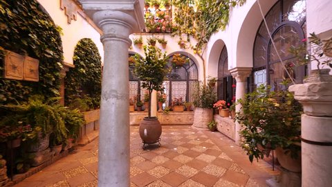 CORDOBA, SPAIN - JUNE, 2018: Beautiful patio full of flowers interior view.