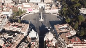 Aerial drone view roatational video of iconic Piazza del Popolo (People's Square) named after the church of Santa Maria del Popolo in the heart of Rome, Italy
