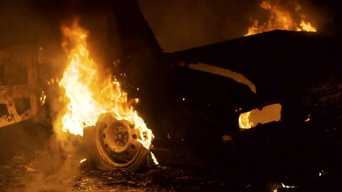 Car In Fire At Night, Burning Car Wheel, Rear View