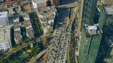 Los Angeles, California CIRCA - 2018. Aerial view of downtown LA traffic on the freeway on a sunny day in Los Angeles, California. Shot on 4K RED camera. 
