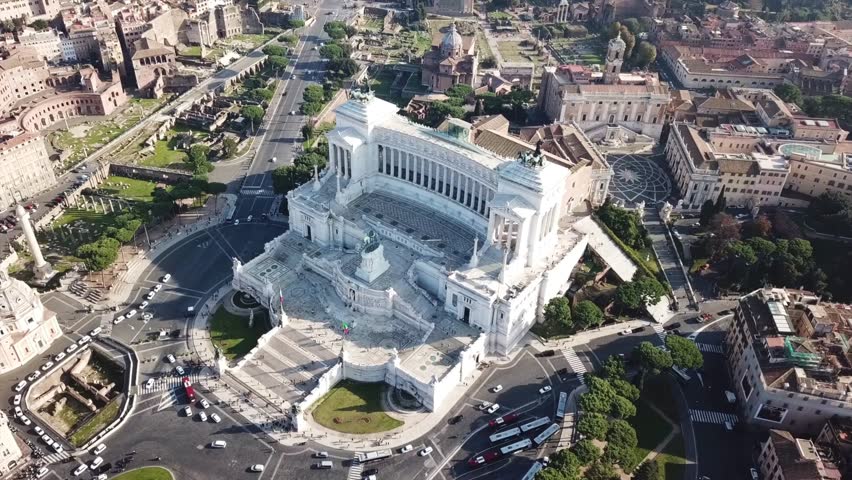 Aerial drone view video of iconic neoclassic building of Altar of the Fatherland - Altare della Patria, known as the national Monument to Victor Emmanuel II in city of Rome, Piazza Venezia, Italy
