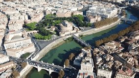 Aerial drone video of iconic and beautiful Castel Sant' Angelo next of Tiber river in the heart of Vatican city in Rome, Italy