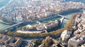 Aerial drone video of famous Tiber river Island or Isola Tiberina in city of Rome, Italy