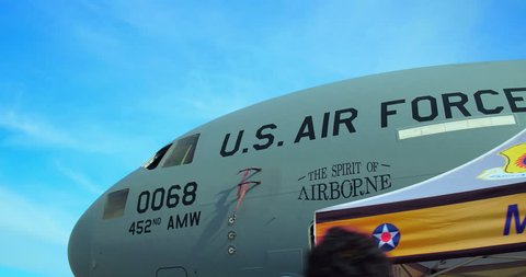 LONG BEACH, CALIFORNIA, USA - NOVEMBER 18, 2018: People discover Air Force McDonnell Douglas C-17A Globemaster III large military transport aircraft at Festival of Flight air show, Long Beach, CA, 4K