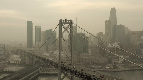San Francisco Bay Bridge In Thick Smoke During November 2018 Wildfires - Aerial Rotation 