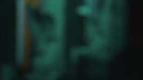 A gothic style stone gargoyle statue lit up by coloured lights. - Powered by Shutterstock - Get 15% off with code: PIKWIZARD15