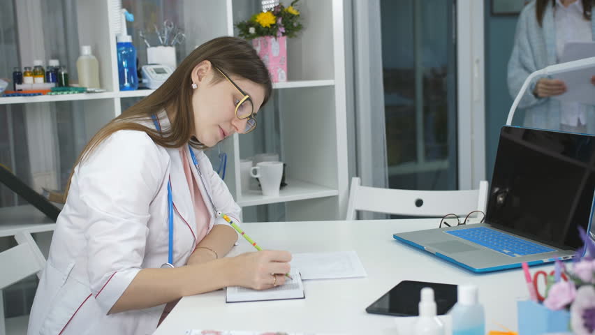 The woman on reception at the doctor's office therapist. | Shutterstock HD Video #1019768650