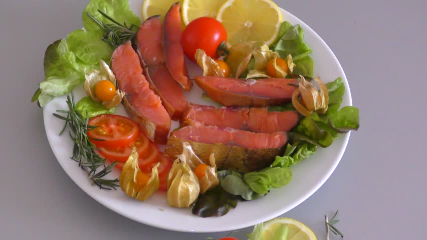 Chinook salmon (LAT. Oncorhynchus tshawytscha) smoked with fresh Greens and vegetables