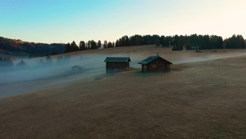 Autumn morning and bright misty sunrise in the valley of Compaccio. Province of Bolzano, Italian Alps