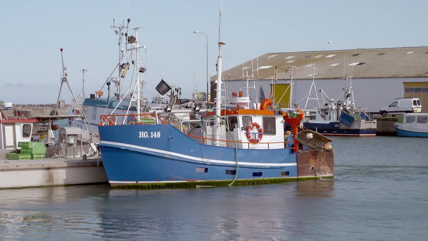 Beautifull and colorfull small fishing boats in small Danish harbour. Hirthals in Denmark. Small boats.