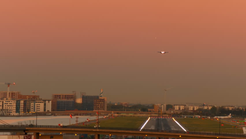 Airliner landing at the London City Airport. It opened in 1987 and serves the financial center of the City and Canary Wharf