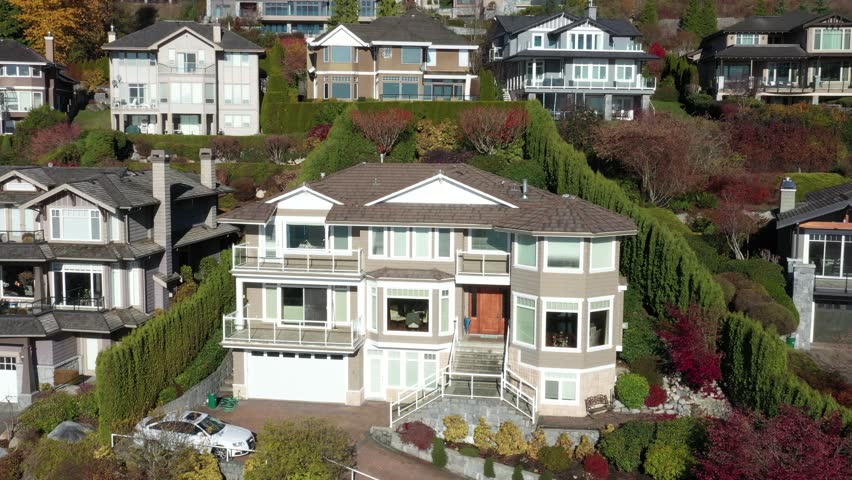 Houses in suburb at Fall in the north America. Luxury houses with nice landscape. Aerial drone view.