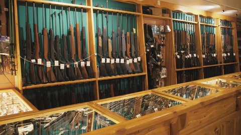 Gun store interior with rifles on showcase