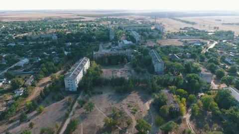  Remarkable bird`s eye shot of Askania-Nova village, the center of Taurida steppe biosphere reserve with multistory houses and parks in summer 