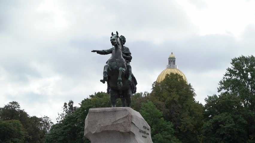 Monument of Russian emperor Peter the Great, known as The Bronze Horseman, in Saint Petersburg, Russia. Peter the first, Isaacs Cathedral on background