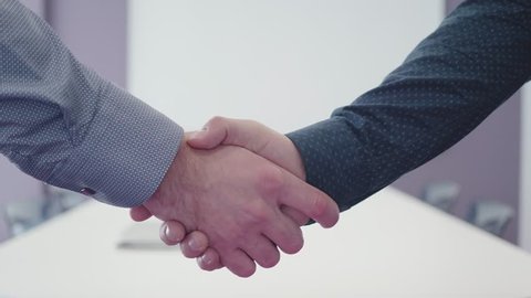 three options handshake of two businessmen 4K unrecognizable close-up