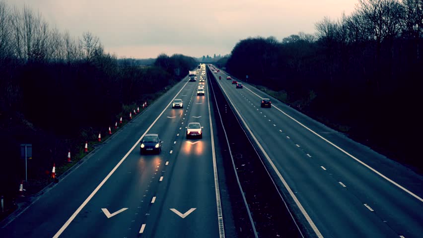 Traffic at dusk, overhead view of vehicles on motorway/ highway, evening Royalty-Free Stock Footage #10198361