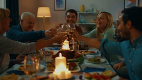 Big Family and Friends Dinner Celebration at Home, Diverse Group of Children, Young Adults and Old People Gathered at the Table have Fun Conversation. Clinking Glasses and Making Toast. - Powered by Shutterstock - Get 15% off with code: PIKWIZARD15