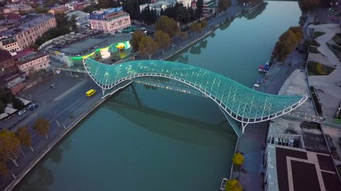 Tbilisi, Georgia - Njvember 8, 2018: View of Bridge of Peace in center of Tbilisi city Rike park
