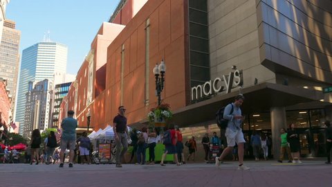 Boston, MA / USA - 07.13.2018: Macy's Shopping Mall with crowds of people walking and american flag waving, Boston