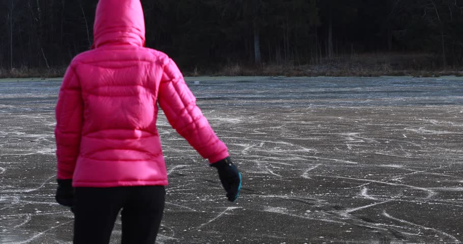 Young women skating in the fresh air over ice. Active lifestyle