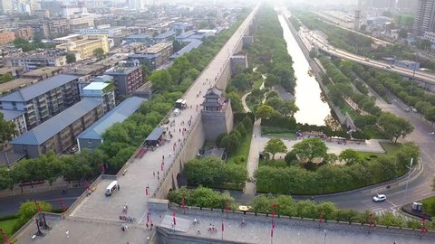 Aerial view over Xi'an City Wall. People ride with bicycles at City Wall. Xian, China.
