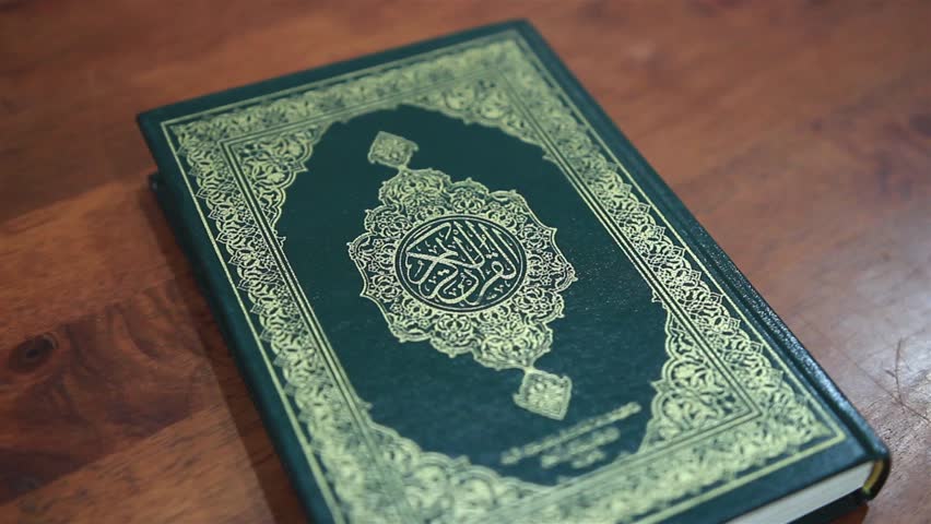 Holy Quran  On Wooden Background Stock Footage Video 100 