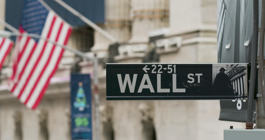 NEW YORK CITY, NEW YORK - NOVEMBER 20 2018: Panning shot of the Wallstreet sign right on the corner of the New York Stock Exchange, also known as the NYSE.
